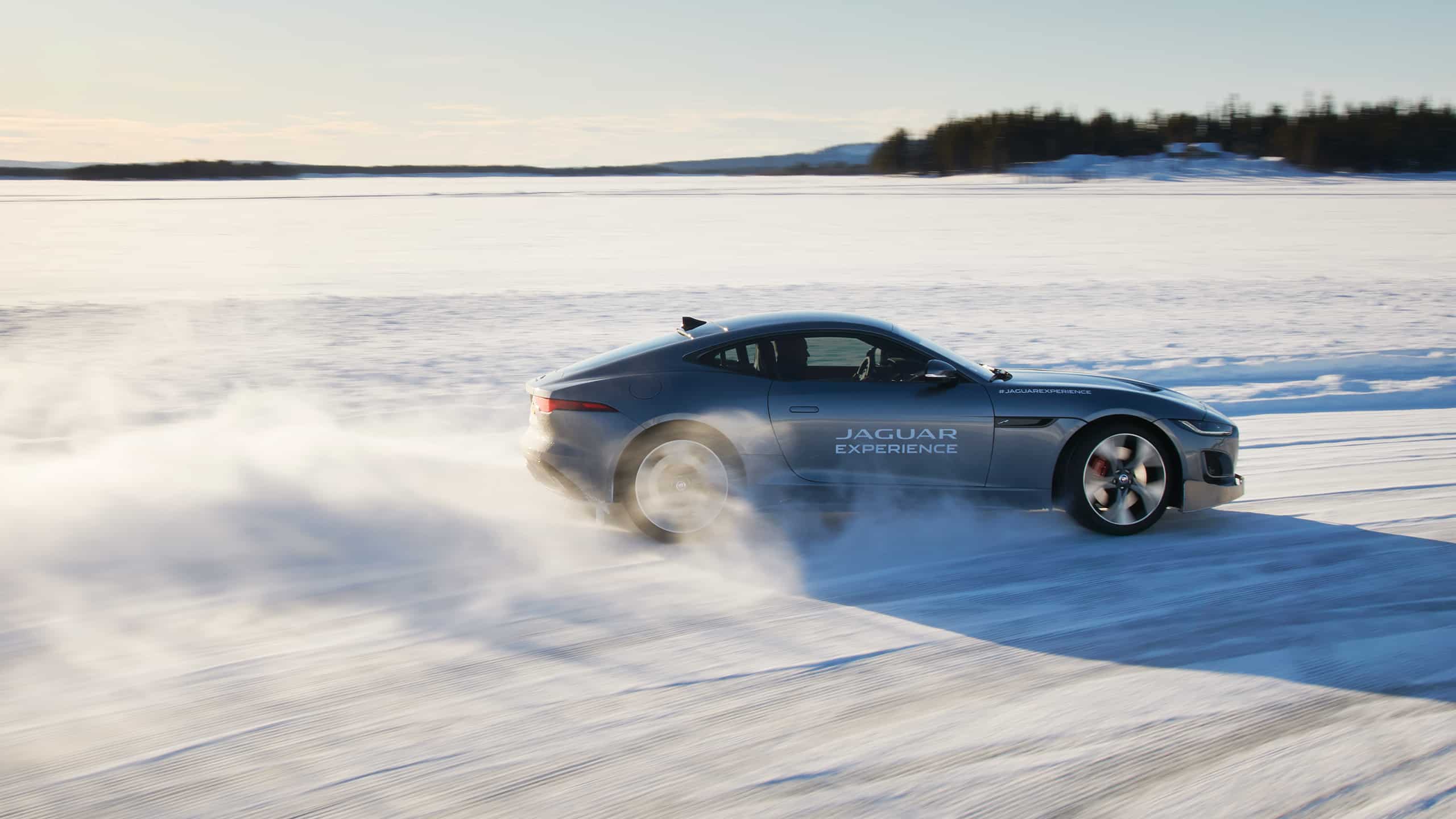Jaguar FTYPE passes through a snowdrift and snowy land road