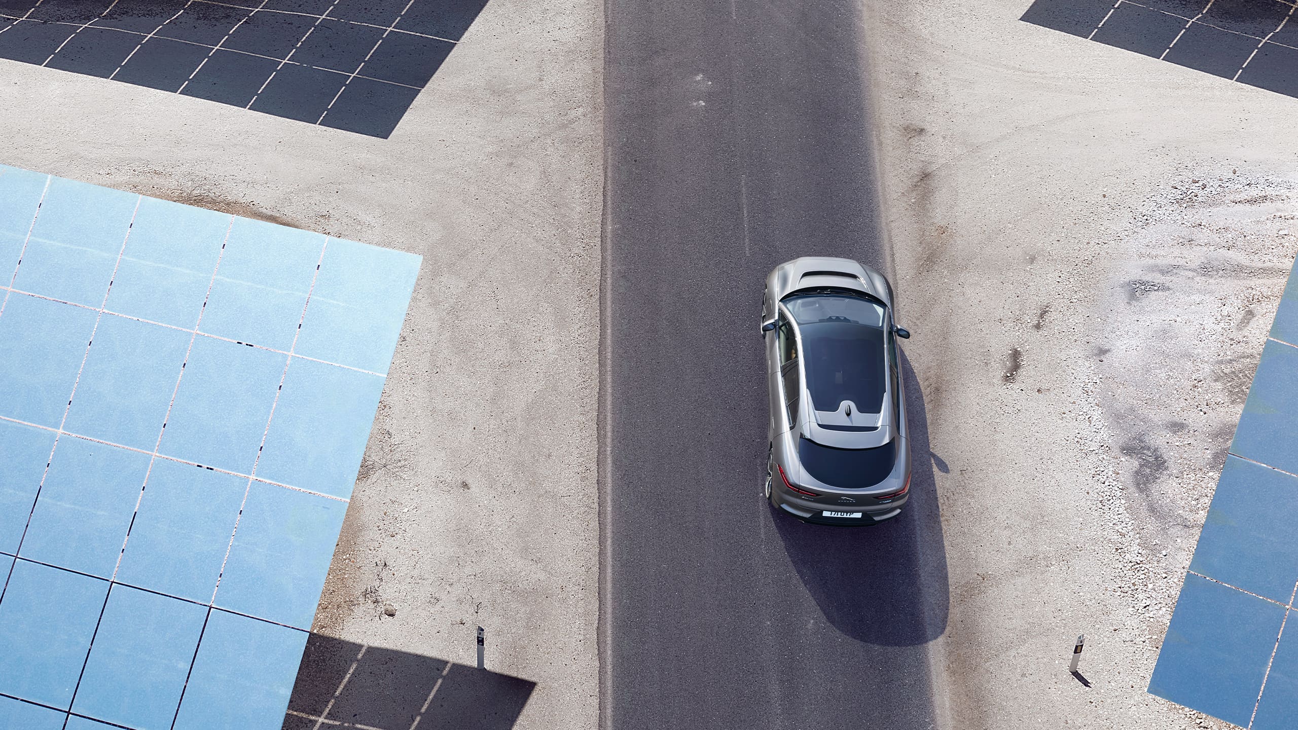 Aerial view of Jaguar I-Pace  running on the road